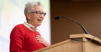 Dorothy Farrar-Edwards at podium