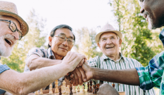 Four men playing chess