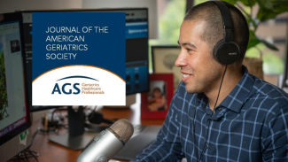 Nathaniel Chin, MD, at his desk with the Journal of the American Geriatrics Society logo on his computer