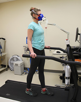 person on treadmill with mask used for health measurements