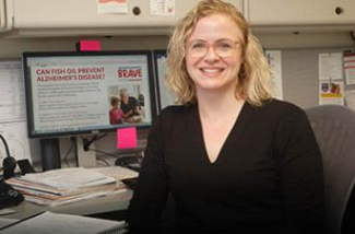 dr cynthia carlsson at a computer in her office