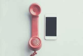 image of rotary phone receiver and smartphone side-by-side