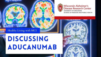 image of brain scans in background with text Discussing Aducanumab