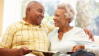 African American couple reading a book