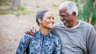 Stock photo of a couple walking on a trail