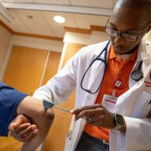 nurse practitioner examining patient