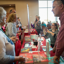 people talking at resource fair