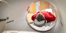 man lying in PET scanner