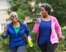 two women power walking