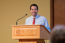 Dr. Nathaniel Chin standing at podium