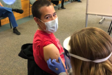 photo of person getting a vaccine shot