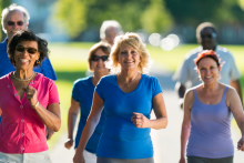 Stock photo of a group of older adults walking.