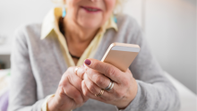 Woman holding a smartphone looking at the screen