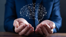 Hands holding an animated brain